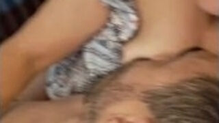 Tip nuzzling my warm, milky breasts and lazily jerking off while he nurses