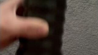 masturbation of a small penis while the woman is in the kitchen