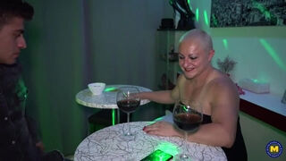 A spirited, short-haired Spanish lady engages in intimate relations with a youthful, attractive young man.