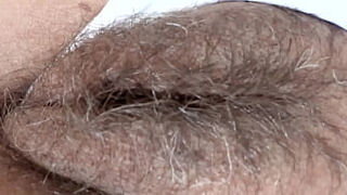 My stepson jerks off while watching my hairy pussy. He cums again and again. He wants to fuck me.