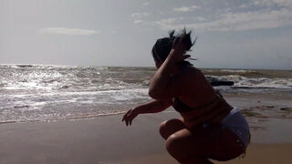 Big ass brunette Latina is very horny and ends up masturbating on the beach, sand and sun