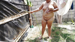 Sexy Colombian girl bathes in a public place and touches her pussy and tits very richly.