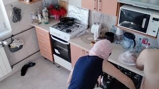 Amateur couple having fun in the kitchen.
