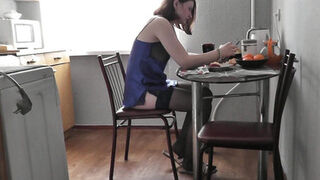 Cute girl. Sexy Assol in erotic lingerie peignoir stockings makes coffee in kitchen. Fetish. Erotica of beautiful woman. Perfect