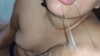 she throws her naughty tongue from side to side, sucking and licking it hornily